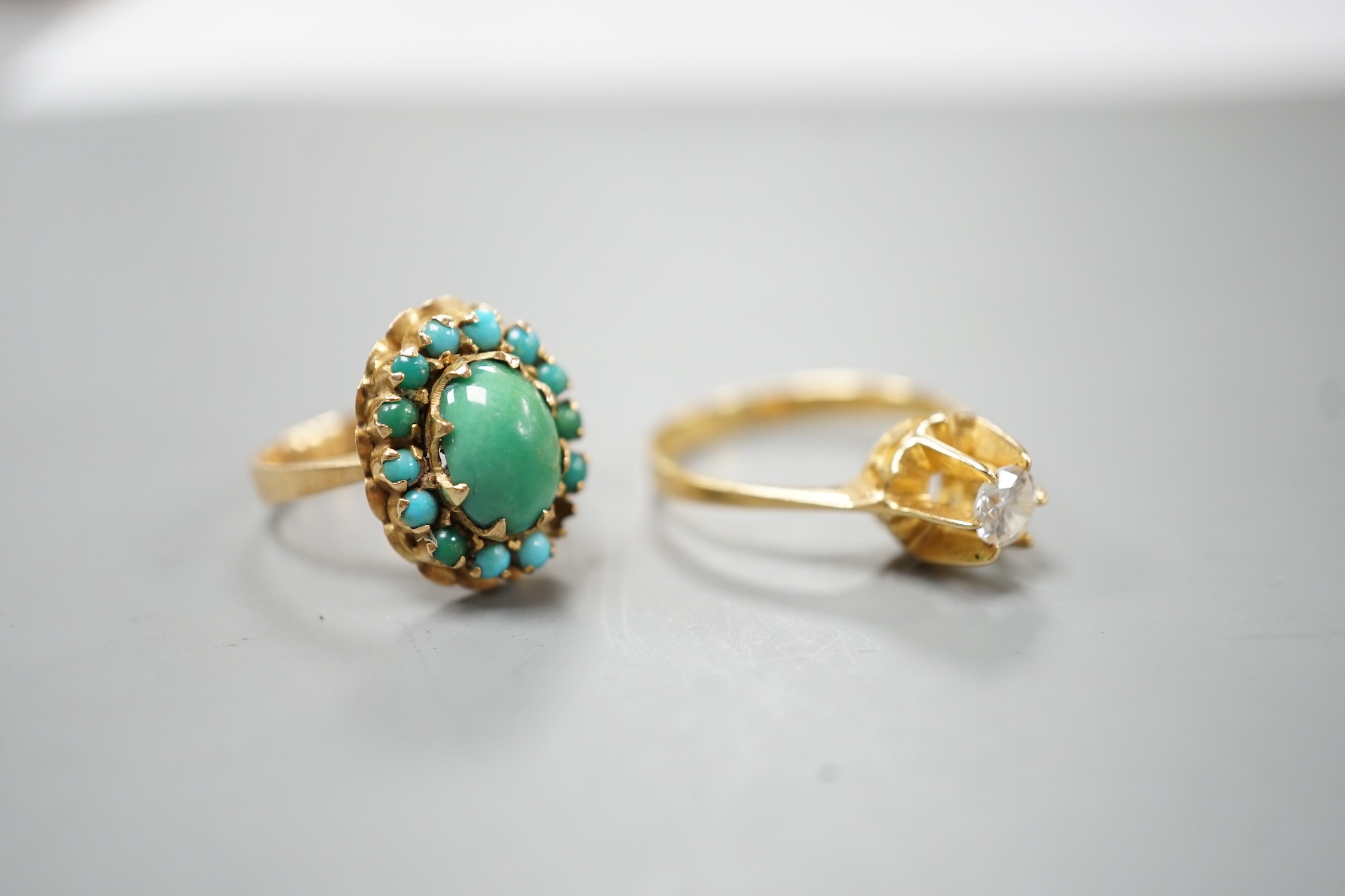 Two 750 yellow metal and gem set rings, turquoise cluster and simulated diamond, gross weight 7.4 grams, (stone missing).